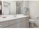 Neutral bathroom has a single sink vanity and a shower with glass doors at 4260 Placida Rd # 13B, Englewood, FL 34224