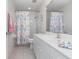 Bathroom with decorative shower curtain and a single sink vanity at 4260 Placida Rd # 13B, Englewood, FL 34224