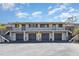 Attractive two-story condo building with private entrances and covered parking spots at 4260 Placida Rd # 13B, Englewood, FL 34224