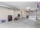 Spacious garage with white walls, various items and an open door at 4260 Placida Rd # 13B, Englewood, FL 34224