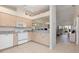 Well-lit kitchen with modern appliances, light wood cabinets, and an open layout into the living space at 4260 Placida Rd # 13B, Englewood, FL 34224