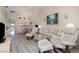 Open living space with comfortable furniture, modern flooring, and a view into the adjacent kitchen at 4260 Placida Rd # 13B, Englewood, FL 34224