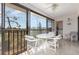 Enclosed patio with dining table, ceiling fan and washer/dryer at 4260 Placida Rd # 13B, Englewood, FL 34224