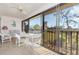 Outdoor enclosed patio with ceiling fan and views of greenery at 4260 Placida Rd # 13B, Englewood, FL 34224
