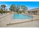 Community pool featuring a spacious deck with plenty of lounge chairs for relaxing in the sun at 4260 Placida Rd # 13B, Englewood, FL 34224
