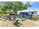 Enjoy outdoor gatherings in this spacious backyard with fire pit and mature trees at 4359 Pocatella Ave, North Port, FL 34287