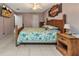 Bedroom with bed, decor, flat screen TV and connecting door at 4359 Pocatella Ave, North Port, FL 34287