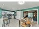 Open kitchen design with stainless steel appliances, dining area, and seamless flow to living space at 4359 Pocatella Ave, North Port, FL 34287