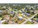 Wide neighborhood shot featuring a single-story home with detached garage on a corner lot at 4474 Ozark Ave, North Port, FL 34287