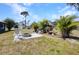 Backyard fire pit area with landscaping at 4474 Ozark Ave, North Port, FL 34287