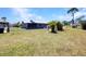 Backyard showing fire pit and landscaping at 4474 Ozark Ave, North Port, FL 34287