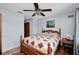 Comfortable bedroom featuring a ceiling fan, closet, side table and a Starry Night picture frame at 4474 Ozark Ave, North Port, FL 34287