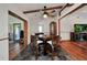 Dining room featuring wood flooring, wooden beams, and ample light at 4474 Ozark Ave, North Port, FL 34287