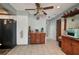 Spacious kitchen includes a moveable island, and stainless refrigerator and freezer at 4474 Ozark Ave, North Port, FL 34287