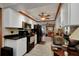 White cabinets, granite countertops, and stainless appliances highlight this kitchen at 4474 Ozark Ave, North Port, FL 34287