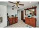 Spacious kitchen includes a moveable island, and stainless refrigerator and freezer at 4474 Ozark Ave, North Port, FL 34287