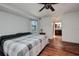 Comfortable main bedroom boasting wood floors, neutral walls, and convenient en-suite access at 4474 Ozark Ave, North Port, FL 34287
