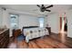Spacious main bedroom featuring hardwood floors, ample natural light, and neutral decor at 4474 Ozark Ave, North Port, FL 34287