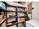 Organized pantry with shelving, various food items, and additional storage space at 4474 Ozark Ave, North Port, FL 34287