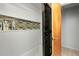 Shower featuring white tile with a decorative tile strip and a glass door at 4474 Ozark Ave, North Port, FL 34287