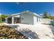 Well-maintained backyard with a screened patio and white rock landscaping, offering a serene outdoor space at 4569 Kenvil Dr, North Port, FL 34288