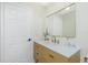 Elegant bathroom with a contemporary sink, a large mirror, and refined fixtures for a spa-like experience at 4569 Kenvil Dr, North Port, FL 34288