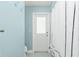 Bathroom featuring shower with decorative shower curtain, white trim and blue walls at 4569 Kenvil Dr, North Port, FL 34288