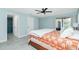 A spacious bedroom featuring a luxurious bed and private access to an elegant en-suite bathroom at 4569 Kenvil Dr, North Port, FL 34288