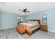 An airy bedroom with large windows, a comfortable bed, and tasteful furnishings for a peaceful retreat at 4569 Kenvil Dr, North Port, FL 34288