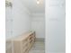 A walk-in closet with custom shelving and drawers, providing ample space for organizing clothes and accessories at 4569 Kenvil Dr, North Port, FL 34288
