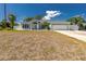Beautiful home featuring a lush front lawn, spacious driveway, and an attached two-car garage at 4569 Kenvil Dr, North Port, FL 34288