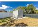 A backyard shed provides additional storage, set in a well-maintained yard with privacy fencing at 4569 Kenvil Dr, North Port, FL 34288
