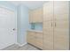 A functional storage room with ample cabinet space and a clean countertop for organization and convenience at 4569 Kenvil Dr, North Port, FL 34288