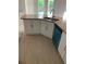 Kitchen island boasts granite countertop, stainless sink, and modern appliances at 47 Tee View Rd, Rotonda West, FL 33947