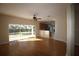 Bright living room featuring hardwood floors and sliding glass doors with a view to the backyard at 4749 Oakley Rd, North Port, FL 34288