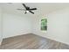 Comfortable bedroom featuring stylish laminate flooring and a bright window at 5611 Ganyard Ave, North Port, FL 34291