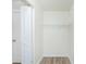 This closet features an open door, wire shelving, and vinyl plank flooring at 5611 Ganyard Ave, North Port, FL 34291
