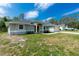 Charming one-story home with a two-car garage and manicured landscaping at 5611 Ganyard Ave, North Port, FL 34291