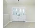Bright foyer with tile flooring and decorative glass front door at 5611 Ganyard Ave, North Port, FL 34291