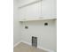 This is the laundry room featuring tile floors and electric hookups for washer and dryer at 5611 Ganyard Ave, North Port, FL 34291