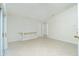 Bright, open-concept living room with neutral tones and tile flooring, bathed in natural light at 5611 Ganyard Ave, North Port, FL 34291