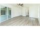 This living room features neutral walls and vinyl plank flooring at 5611 Ganyard Ave, North Port, FL 34291
