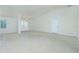 Open-concept living room with tile flooring and decorative wainscoting at 5611 Ganyard Ave, North Port, FL 34291