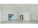 Spacious open-concept living area with tile flooring and natural light at 5611 Ganyard Ave, North Port, FL 34291