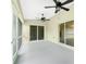 The roomy, screened-in lanai offers dual ceiling fans and access to the backyard at 5611 Ganyard Ave, North Port, FL 34291