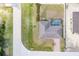 A bird's eye view of a property showcasing a screened pool and well-maintained landscaping at 6235 Bixel Ln, Englewood, FL 34224