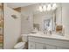 Bathroom with white vanity and sink, coastal decor, and shower/tub combo in view at 6235 Bixel Ln, Englewood, FL 34224