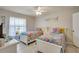 Bedroom with two beds, ceiling fan, and neutral wall color at 6235 Bixel Ln, Englewood, FL 34224