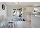 Cozy dining area with seating for four and access to the screened patio at 6235 Bixel Ln, Englewood, FL 34224