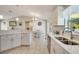 Eat-in kitchen with granite counters, stainless steel appliances, and updated cabinets at 6235 Bixel Ln, Englewood, FL 34224